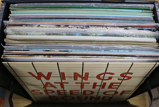 A box of mixed LPs containing The Beatles, Wings, Creedence Clearwater Revival, The Stranglers,